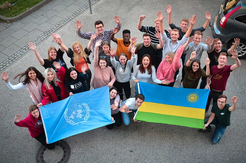 ESB Students posing behind flags 