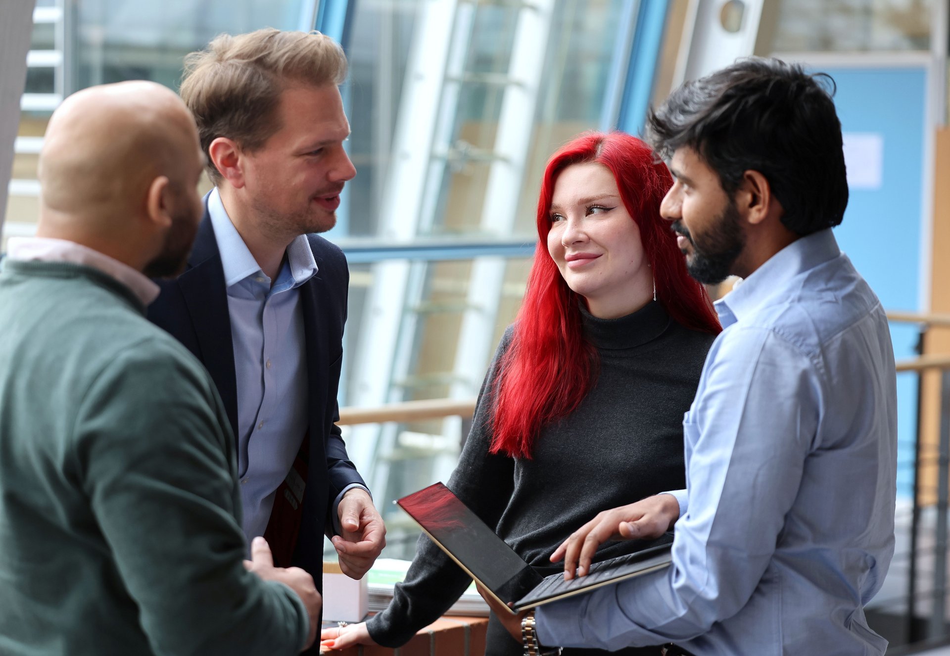 Student group speaking with a lecturer