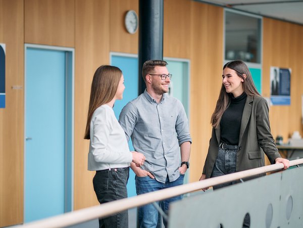 International Industrial – Operations students interacting in the hallway of the ESB Business School