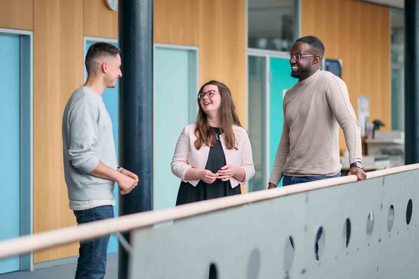 MBA students at the ESB Business School chatting in the hallway.