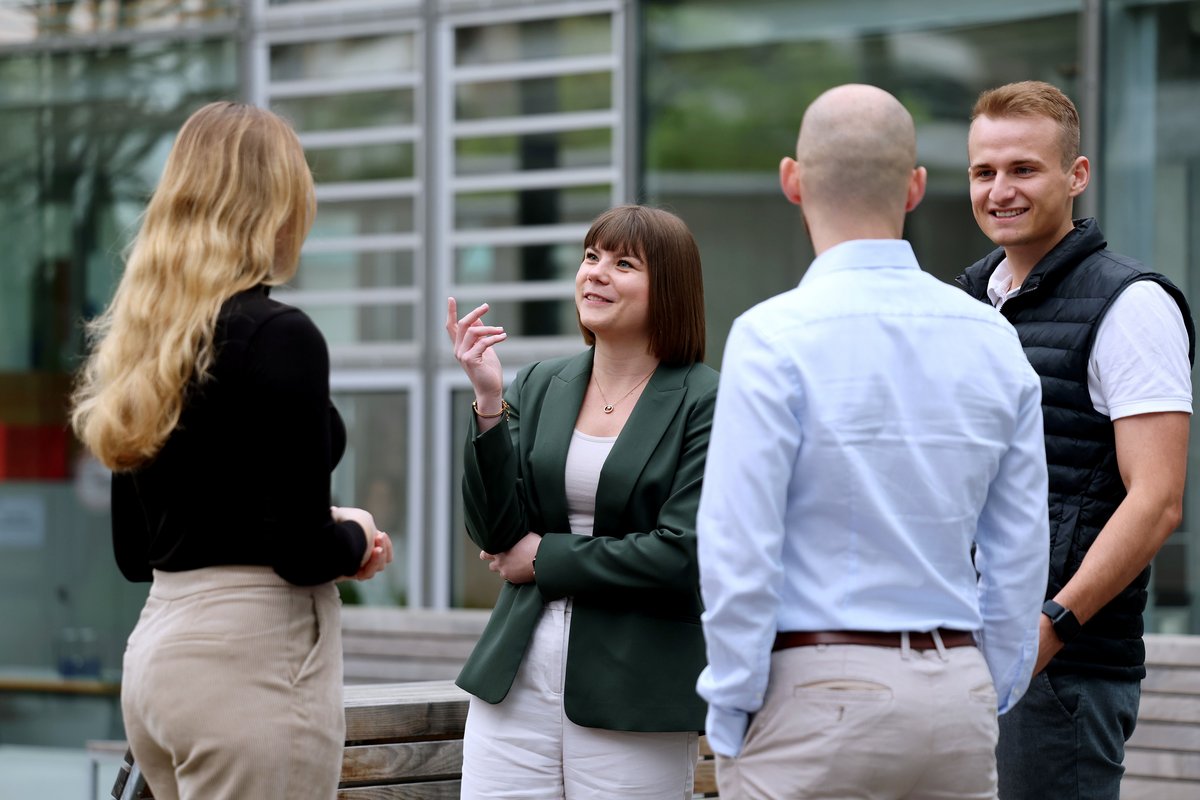 A group of master’s students talking 