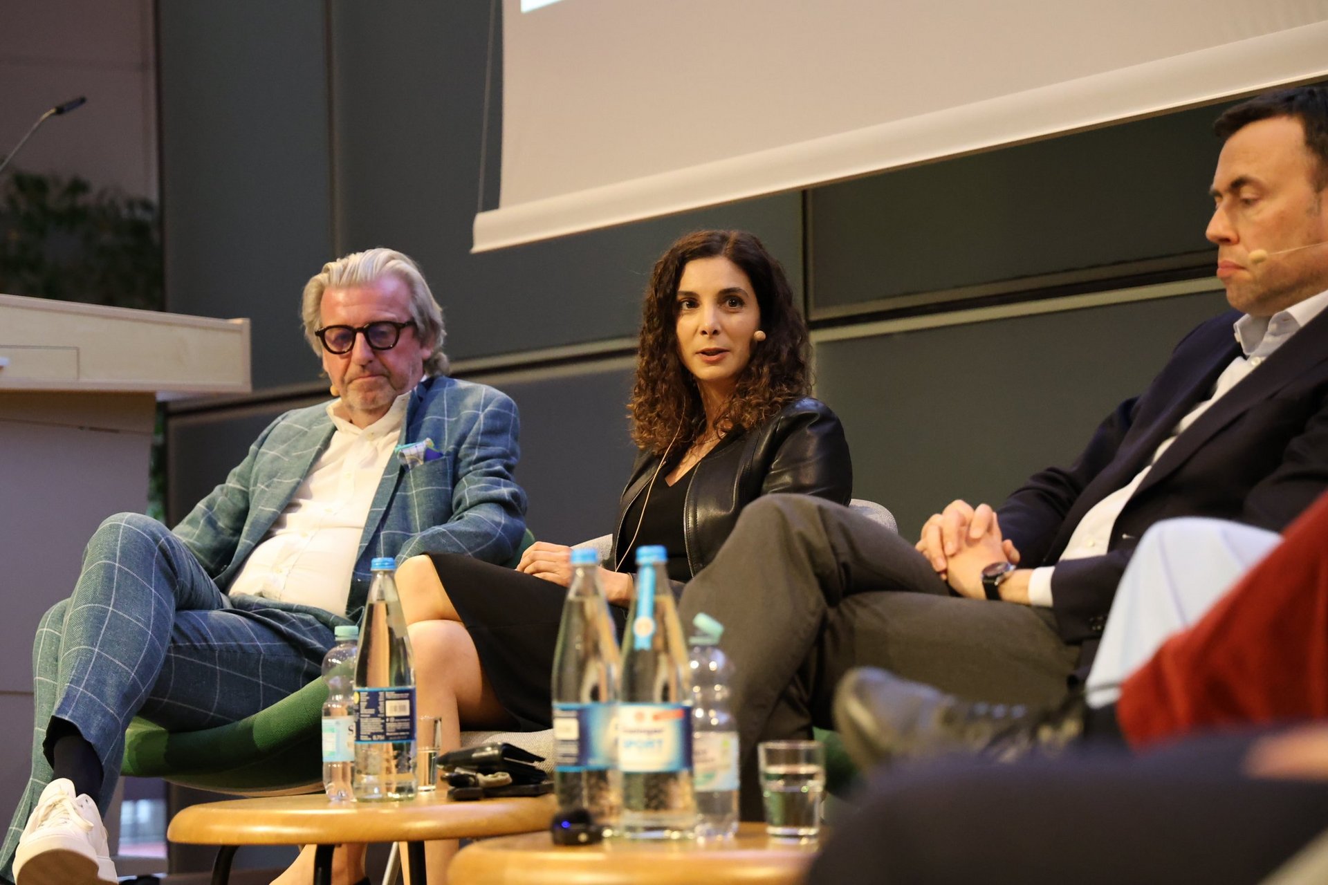 Stefan Wolf, Jessica Tatti and Nils Schmid (left to right) on the panel 